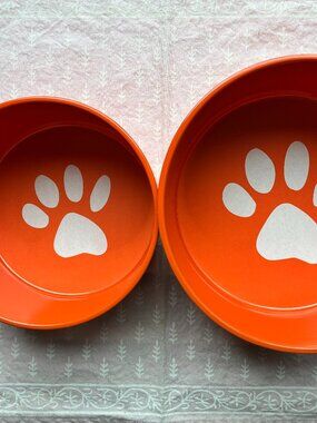 Set of orange dog bowls by Ore Originals. NWT